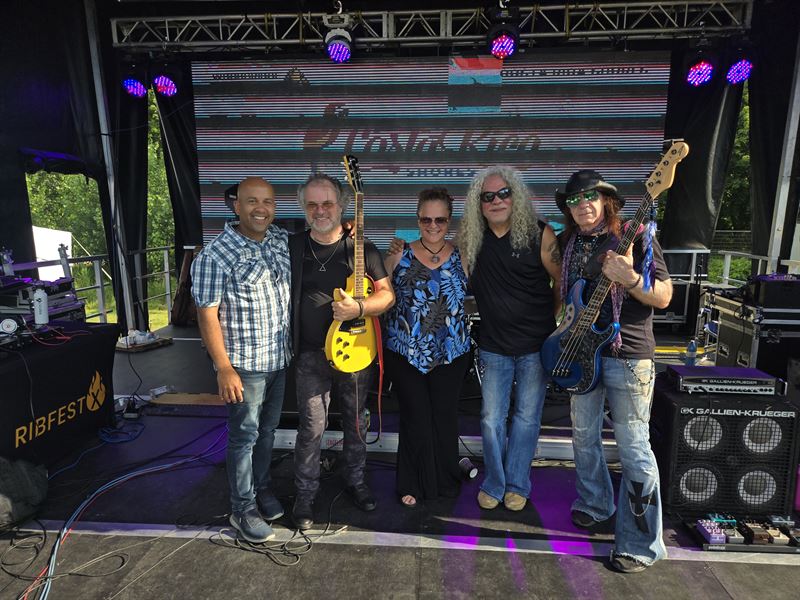 All five members of Ramblin Soul' together on stage at an outdoor Ribfest