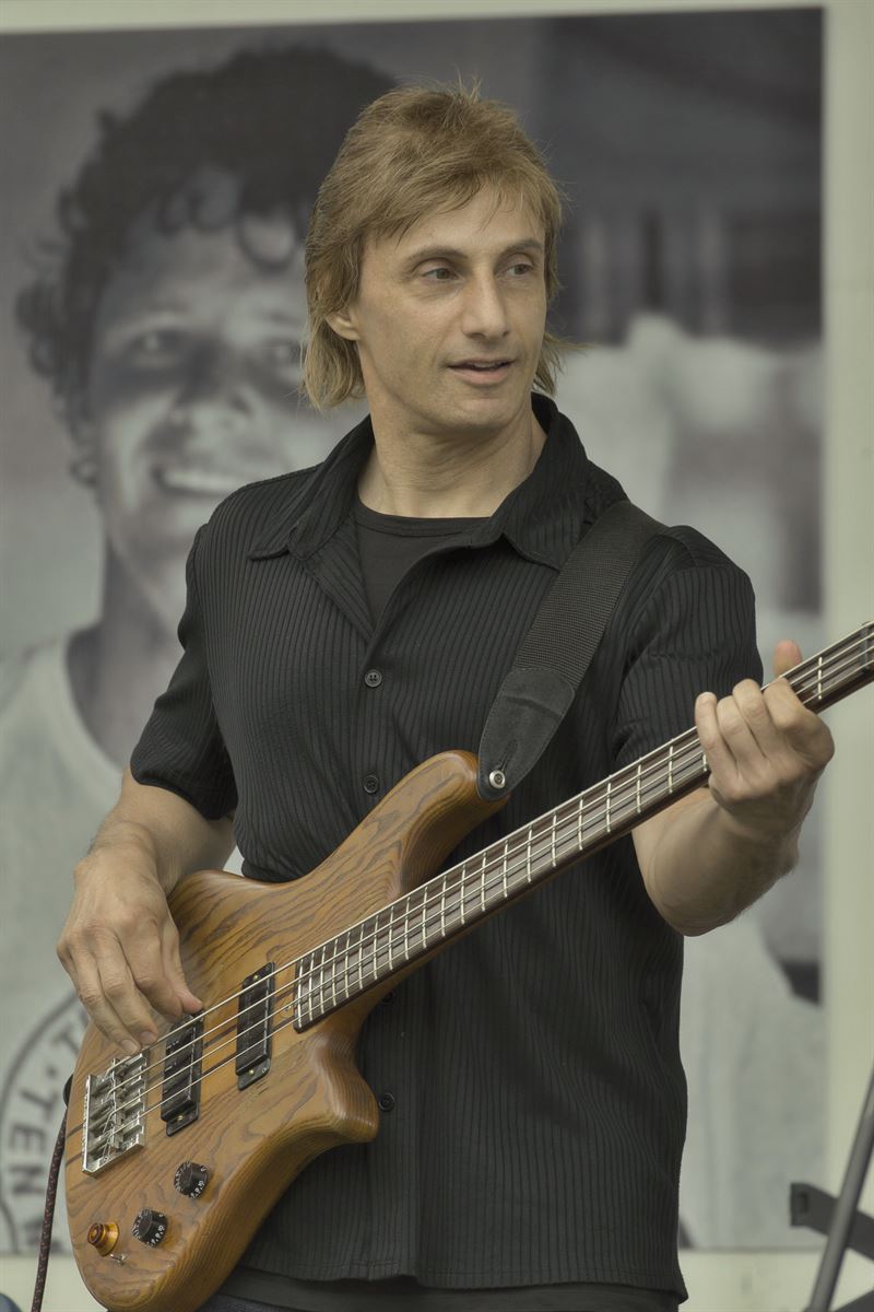 Bassist performing at an outdoor show