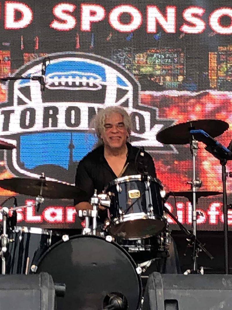 Drummer playing a festival stage in Toronto