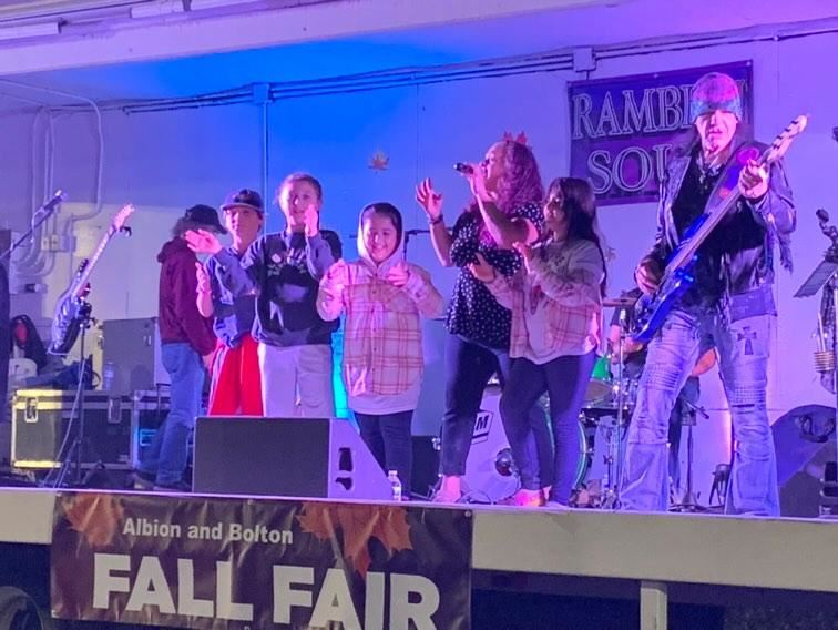 Guests dancing on stage with the band at the Albion and Bolton Fall Fair