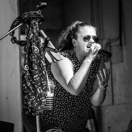 Ramblin Soul's lead singer at the microphone, in black and white