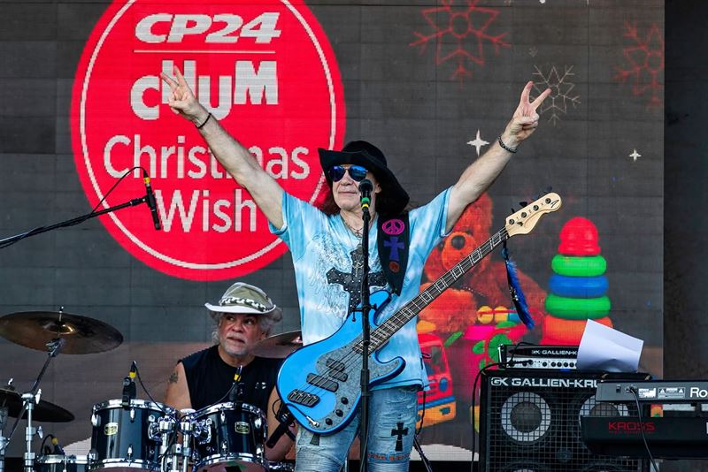 Bassist celebrating on stage at the CP24 CHUM Christmas Wish event